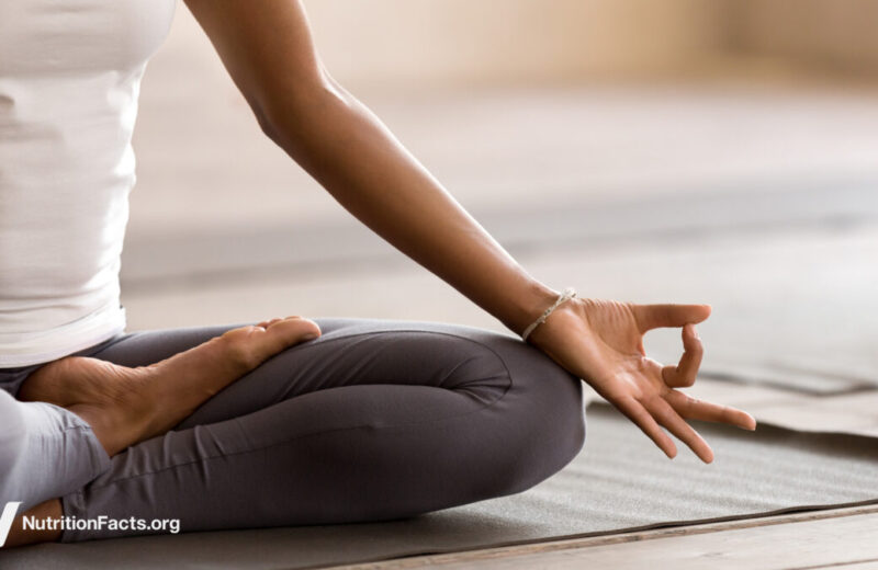 women sitting in lotus pose